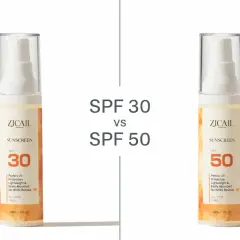 Deux flacons de crème solaire ZICAIL, l'un avec SPF 30 et l'autre avec SPF 50, côte à côte.